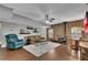 Cozy living room with a wood burning stove, ceiling fan, comfortable furniture, and lots of natural light at 218 Sutallee Ridge Ne Ct, White, GA 30184