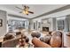 Open-concept living room with a fireplace, hardwood floors, and views of the adjacent dining area at 218 Sutallee Ridge Ne Ct, White, GA 30184