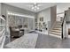 Cozy living room with large windows, a comfortable armchair, and a decorative bookshelf at 218 Sutallee Ridge Ne Ct, White, GA 30184