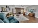 Cozy living room with wood floors, brick accent wall, wood-burning stove and comfortable seating at 218 Sutallee Ridge Ne Ct, White, GA 30184