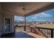 Cozy back porch with wooden railings, a ceiling fan, and views of the neighborhood at 2300 Kate Moore Way, Buford, GA 30518