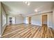 Finished basement with wood floors and neutral walls at 2300 Kate Moore Way, Buford, GA 30518