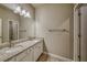 Bathroom features double sinks, granite countertops, white cabinets, and modern fixtures at 2300 Kate Moore Way, Buford, GA 30518