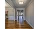 A wide hallway with wood floors leads to other rooms, highlighting the home's open layout at 2300 Kate Moore Way, Buford, GA 30518