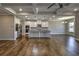 Panoramic shot of living room and kitchen with hardwood floors at 2300 Kate Moore Way, Buford, GA 30518