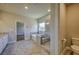 Bright main bathroom features soaking tub, walk-in shower, and neutral flooring at 2300 Kate Moore Way, Buford, GA 30518