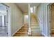 A stairway leading to the upstairs with wood floors at 2300 Kate Moore Way, Buford, GA 30518