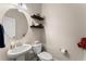 Powder room with a pedestal sink, decorative shelving, and tile flooring with neutral wall color at 232 Providence Ln, Canton, GA 30114