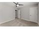 Cozy bedroom featuring neutral walls, carpet, and a ceiling fan for comfort at 232 Providence Ln, Canton, GA 30114