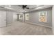 Large carpeted bedroom with ceiling fan, recessed lighting, and ample natural light from two windows at 232 Providence Ln, Canton, GA 30114