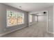 Bright bedroom with large windows and plush carpeting with entrance into connected sitting room with tray ceiling at 232 Providence Ln, Canton, GA 30114