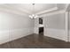 Bright dining room with coffered ceiling, chandelier, wainscoting, and hardwood floors at 232 Providence Ln, Canton, GA 30114