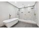 Modern bathroom featuring a soaking tub and a spacious, tiled shower with dual shower heads at 3139 Alston Dr, Decatur, GA 30032