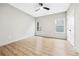 Bedroom with wood-look flooring, modern ceiling fan, and windows for natural light at 3139 Alston Dr, Decatur, GA 30032