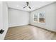 Bright, empty bedroom with hard wood floors, a ceiling fan and double windows at 3139 Alston Dr, Decatur, GA 30032