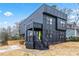 Contemporary black home boasts clean lines, a covered porch, and modern curb appeal at 3139 Alston Dr, Decatur, GA 30032