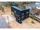 An aerial view shows a modern black home with a newly installed concrete sidewalk at 3139 Alston Dr, Decatur, GA 30032