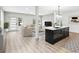 This view shows an open-concept living room with a modern kitchen and center island at 3139 Alston Dr, Decatur, GA 30032