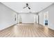 Large living room featuring wood-look floors, modern ceiling fan, and access to the ensuite bath at 3139 Alston Dr, Decatur, GA 30032