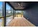 A modern porch with metal and wood finishes and black ceiling at 3139 Alston Dr, Decatur, GA 30032