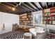 Basement book room featuring ample shelving, a window, and an accent rug at 7452 Mount Vernon Rd, Lithia Springs, GA 30122