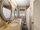 Well-lit bathroom featuring double sinks, a granite countertop, and a shower, offering a modern and functional space at 7452 Mount Vernon Rd, Lithia Springs, GA 30122