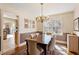 Dining room with chandelier, traditional table, and classic accents at 7452 Mount Vernon Rd, Lithia Springs, GA 30122