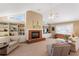 Bright living room showcasing a brick fireplace, built-in shelving, and ample natural light, creating a cozy atmosphere at 7452 Mount Vernon Rd, Lithia Springs, GA 30122