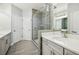 Large bathroom with double sink and stand up shower with glass door at 146 Rowan Ave, Alpharetta, GA 30009