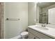 Modern bathroom with a white vanity, tiled shower, and neutral color palette at 146 Rowan Ave, Alpharetta, GA 30009