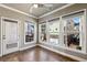 This bedroom features hardwood floors, neutral paint, a ceiling fan, and multiple windows for natural light at 146 Rowan Ave, Alpharetta, GA 30009