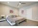 Main bedroom with a large bed, side tables, and art at 146 Rowan Ave, Alpharetta, GA 30009