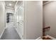 Hallway with carpet floor and view to a bedroom with stylish wallpaper at 146 Rowan Ave, Alpharetta, GA 30009