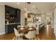 Modern kitchen and dining area featuring pendant lighting, island with bar stools, and open layout at 146 Rowan Ave, Alpharetta, GA 30009