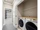 Functional laundry area featuring new washer and dryer, with space for folding and storage at 146 Rowan Ave, Alpharetta, GA 30009