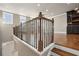 Stylish loft space with hardwood floors, iron railing, and an open view of the living area at 146 Rowan Ave, Alpharetta, GA 30009