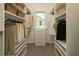 Spacious walk-in closet with custom shelving and a window for natural light at 146 Rowan Ave, Alpharetta, GA 30009