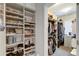 Spacious walk-in closet with extensive shelving and hanging space for optimal organization at 146 Rowan Ave, Alpharetta, GA 30009
