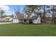 Quaint two-story home with a covered porch, two-car garage, and a well-manicured lawn at 159 Sequoyah Cir, Canton, GA 30115