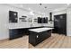 Sleek kitchen with black cabinets, a white countertop island, and stainless steel appliances at 2402 Lynn Iris Dr, Decatur, GA 30032