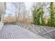 Large back deck with decorative railings and view of the surrounding trees at 3661 Silver Leaf Sw Ln, Marietta, GA 30008