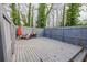 Spacious back deck with gray stained wood and fenced in perimeter, great for entertaining at 3661 Silver Leaf Sw Ln, Marietta, GA 30008
