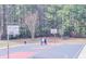 Enjoy outdoor recreation with this community basketball court surrounded by lush trees and fresh air at 3661 Silver Leaf Sw Ln, Marietta, GA 30008