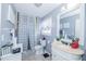 A quaint bathroom featuring neutral colors and a vanity sink at 3661 Silver Leaf Sw Ln, Marietta, GA 30008