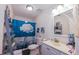 Bathroom featuring a vanity, toilet, tub with white rose curtain, and gray ladder shelving at 3661 Silver Leaf Sw Ln, Marietta, GA 30008
