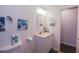 Bathroom featuring a vanity, toilet, and decorative accents at 3661 Silver Leaf Sw Ln, Marietta, GA 30008