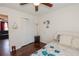 Bedroom featuring wood floors, white walls, closet, ceiling fan and a comfortable bed at 3661 Silver Leaf Sw Ln, Marietta, GA 30008