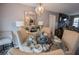 An inviting dining room featuring a glass table and stylish decor at 3661 Silver Leaf Sw Ln, Marietta, GA 30008