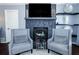 Stylish fireplace with stone surround and decorative shelving, creating a focal point in the cozy living space at 3661 Silver Leaf Sw Ln, Marietta, GA 30008