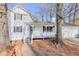 Charming two-story home featuring a covered front porch and a well-maintained yard with mature trees and a two-car garage at 3661 Silver Leaf Sw Ln, Marietta, GA 30008